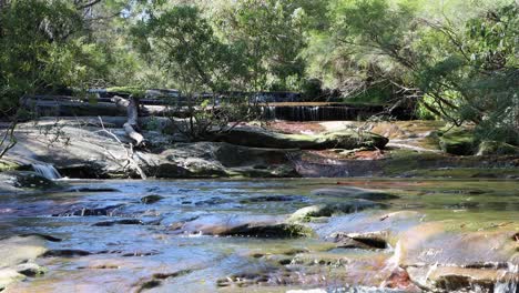 Somersby-falls-stone-slabs-close-to-Sydney-Australia-in-the-Brisbane-Water-National-Park,-Locked-wide-shot