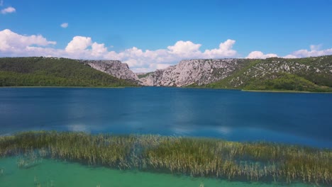 Flying-fast-forward-across-Krka-National-Park-lakes-and-mountains-in-Dalmatia,-Croatia-filmed-in-4k