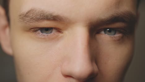Young-Caucasian-Guy-With-Grey-Eyes-Facing-The-Camera---Extreme-Closeup-Shot