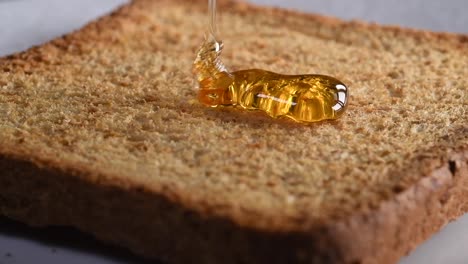 Honey-falling-on-toast-in-slow-motion