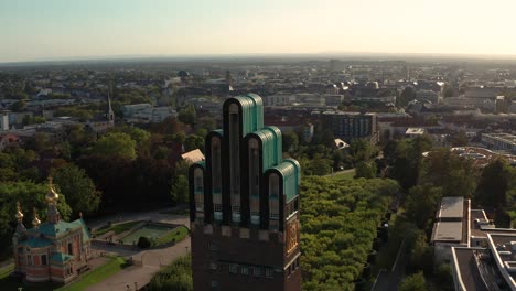 The-Hochzeitsturm-Darmstadt-at-the-Mathildenhoehe-by-a-drone-with-the-city-in-the-background-on-a-sunny-summer-day