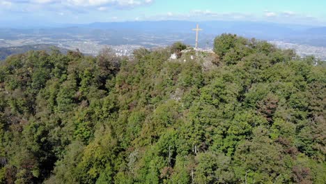 Aerial-view-of-Christian-cross-on-top-of-mountain-,-Celje,-Slovenia