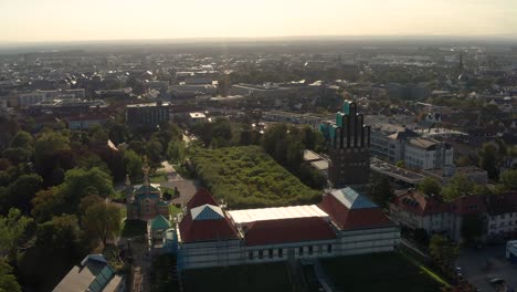Opening-Up-the-down-town-area-of-Darmstadt-City-with-Mathildenhoehe-in-the-Foreground-on-a-sunny-summer-day-with-a-drone-in-Germany