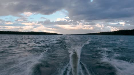 Speeding-boat-on-a-lake-under-a-splendid-cloudy-sky