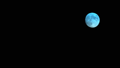 Small-Rising-Full-Moon-Changing-Colours,-Astro-Time-Lapse