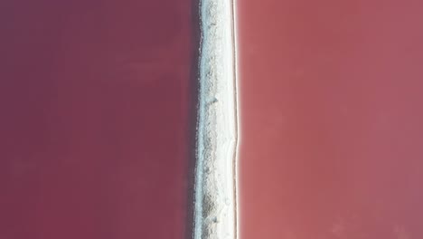 Aerial-View-of-Pink-Salt-Lakes-Water-Patterns-and-Salty-Barrier