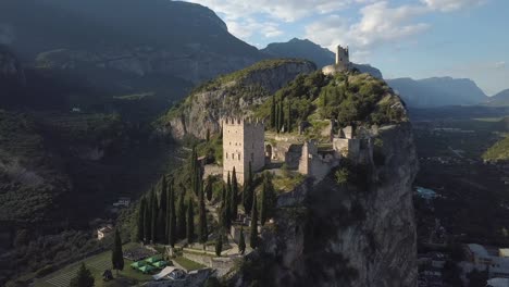 Old-European-fort-castle-remains-on-top-of-a-mountain-cliff-side,-Castello-di-Arco,-Riva-del-Garda