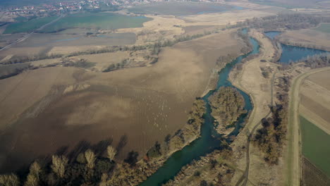 Agriculture-land--and-river-drone-view-in-hungary