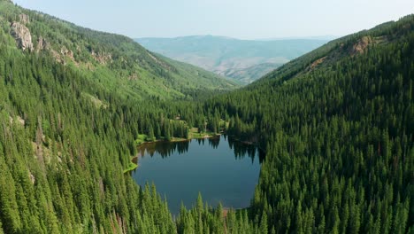 Aerial-Drone-footage-approaching-Beaver-Lake-in-Beaver-Creek,-Colorado