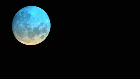 Closeup-Of-Colourful-Full-Moon-Isolated-In-The-Night-Sky