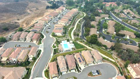 Flight-over-Los-Angeles-neighborhood-of-houses,-American-city-suburb,-aerial-view