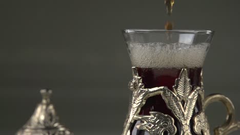 serving-Turkish-çay-in-traditional-metal-cup