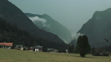 timelapse-of-rain-clouds-on-countryside-farm-Gosau-Austria-with-cows-on-the-green-field