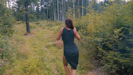 Pretty-woman-dancing-in-a-forest-in-slow-motion