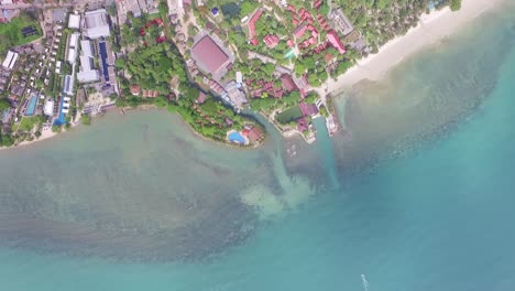 Aerial-rotating-view-above-Koh-Chang-relaxing-island-turquoise-coastal-vacation-resort-hotel
