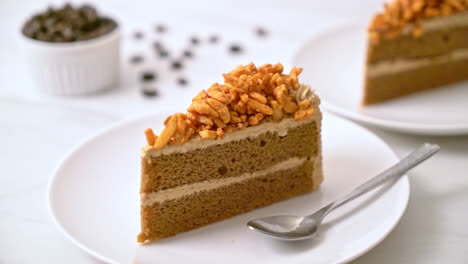 homemade-coffee-almonds-cake-on-white-plate