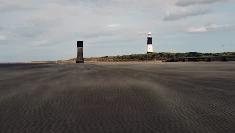 Wind-makes-Sand-Waves-with-two-towers-in-distance