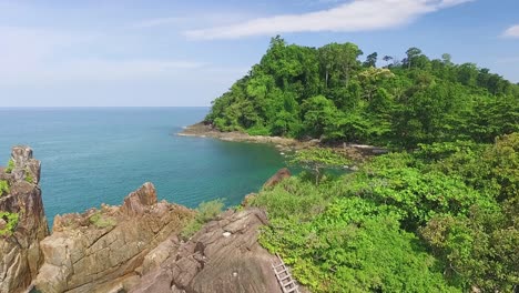 Lush-green-rocky-Koh-Chang-fantasy-paradise-island-coastline-Thailand-turquoise-ocean-bay-rising-aerial-view