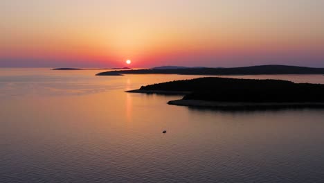 Aerial-shot-of-a-beautiful-sunset-over-the-island-of-Mali-Losinj,-in-Croatia