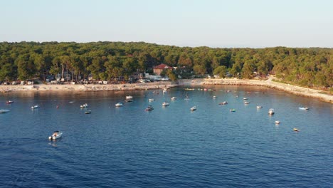 Aerial-view-of-a-small-boat-area-in-a-camping-zone-of-the-island-of-Mali-Losinj-in-Croatia