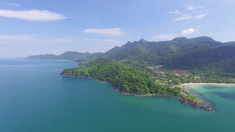 Lush-Koh-Chang-fantasy-exotic-island-turquoise-and-green-mountain-range-coastline-aerial-view