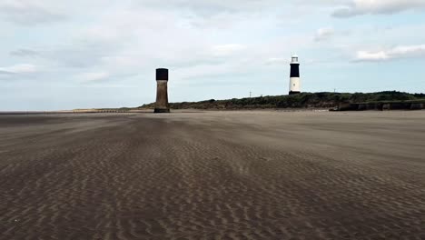 Wind-makes-Sand-Waves-with-two-towers-in-distance