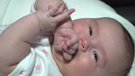 Newborn-infant-baby-girl-uncomfortable-feeling-or-hunger