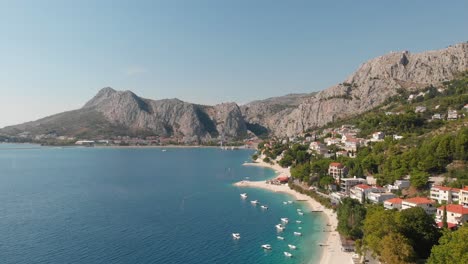 Panoramic-footage-over-beach-and-Brzet,-Omis-in-Croatia-with-the-wonderful-view-over-Adriatic-Sea