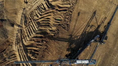 Birds-eye-view-of-a-huge-blue-crane-with-an-excavator