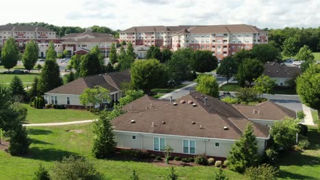 Aerial-establishing-shot-of-retirement-in-America,-independent-assisted-living-homes-and-residential-nursing-care-CCRC-buildings,-Medicare,-old-age,-death-and-disability,-rehab-center,-elderly-patient