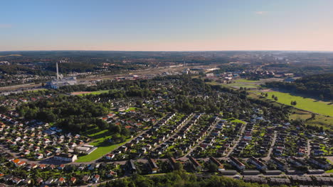 Aerial-landscape-above-east-Gothenburg-suburbs-district,-Sweden,-sunset