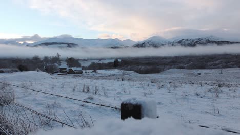 Time-Lapse-clouds-above-the-mountains,-winter-scene,-snowy-landscape,-highlands,-Scotland,-static-shot