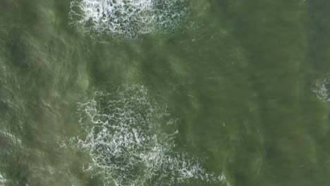 AERIAL:-Top-View-Ascending-Shot-of-Waves-of-Baltic-Sea-on-Windy-Day