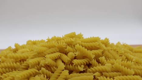 Raw-Fusilli-on-wooden-table.-Traditional-italian-pasta