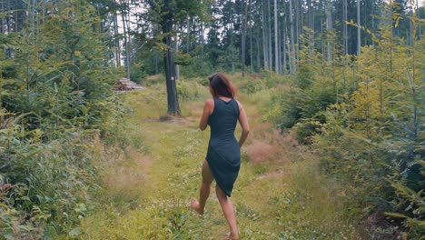 Pretty-woman-dancing-in-a-forest-in-slow-motion