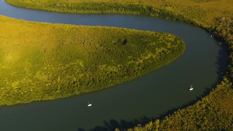 Aerial:-boats-on-Daintree-River-at-sunset,-Australia