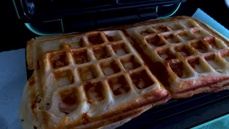 Delicious-Waffles-Cooked-In-Waffle-Maker-In-The-Kitchen---close-up