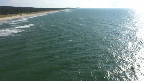AERIAL:-Flying-Towards-Surfers-Riding-with-Wind-Kites-on-Baltic-Sea-Waves