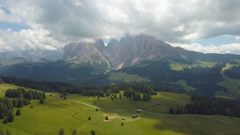 Reveal-Aerial-of-the-Dolomites-Mountains-at-Alpe-di-Siusi,-Ortisei,-Italia
