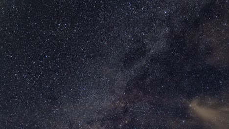 Milky-Way-and-star-time-lapse-with-moving-clouds,-airplanes-on-clear-night-until-dusk