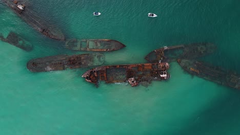 Tangalooma-shipwrecks-off-Moreton-Island-Australia,-rising-aerial-top-down-view