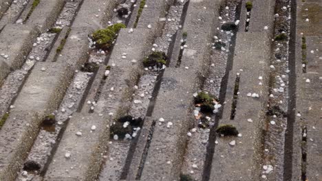 Bad-storm-season-weather-ice-hail-and-rain-on-tiled-house-roof