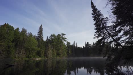 Beautiful-Landscape-With-Steam-Rising-On-Lake,-Algonquin-Park