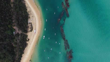 Aerial:-Moreton-Island-Tangalooma-shipwrecks,-Australia,-top-down-view