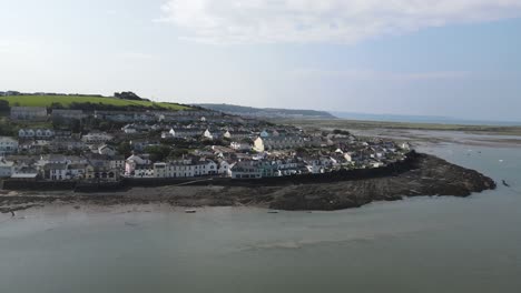 Appledore-Devon-small-coastal-town-aerial-panning-left-to-right-along-waterfront-tide-out-summers-day-tide-is-out