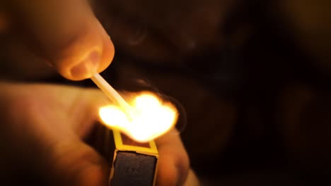 Hand-striking-match-slow-motion-combustion-bright-hot-flame