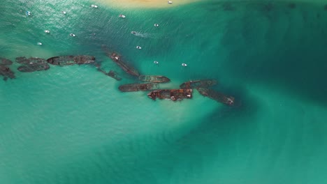 Tourist-destination:-Tangalooma-shipwrecks-Moreton-Island-Australia,-high-aerial