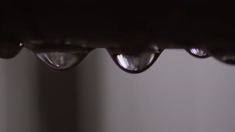 Water-Droplet-Leaking-from-Plumbing-Metal-Pipe,-Extreme-Closeup