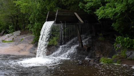 Crooked-Slide-Park,-Combermere-Ontario---180fps-Slow-Motion---Wide-angle-Water-Falling-Waterfall-from-Old-Log-Chute