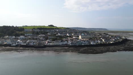 Appledore-Devon-aerial-left-to-right-along-waterfront-with-tide-out-town-and-green-hills-in-background
